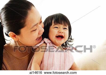 Mother and baby girl, smiling View Large Photo Image Stock Photograph - Mother and baby girl, smiling. Fotosearch