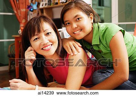 Mother and daughter, portrait, looking at camera View Large Photo Image Stock Photo - Mother and daughter, portrait, looking at camera. Fotosearch