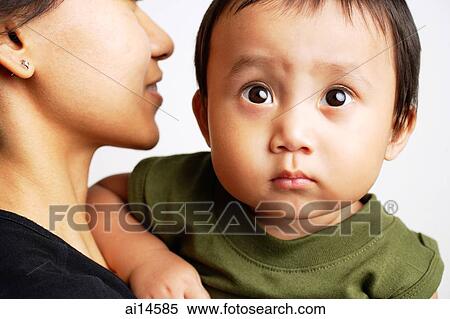Mother carrying baby boy, boy looking forward View Large Photo Image Stock Photography - Mother carrying baby boy, boy looking forward. Fotosearch
