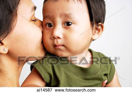 Mother kissing baby boy View Large Photo Image Stock Photo - Mother kissing baby boy. Fotosearch