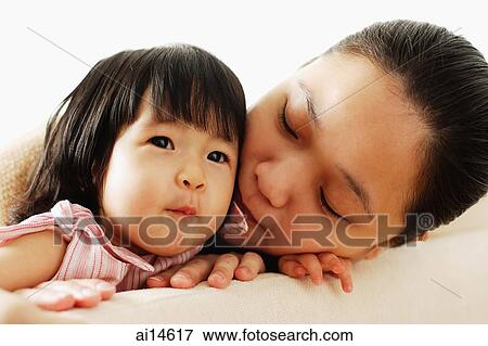 Mother next to baby girl View Large Photo Image Stock Photo - Mother next to baby girl. Fotosearch