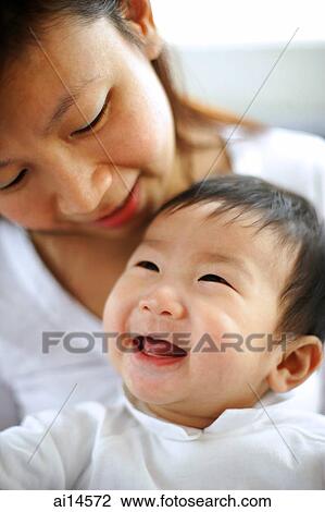 Stock Image - Mother with baby boy, portrait. Fotosearch