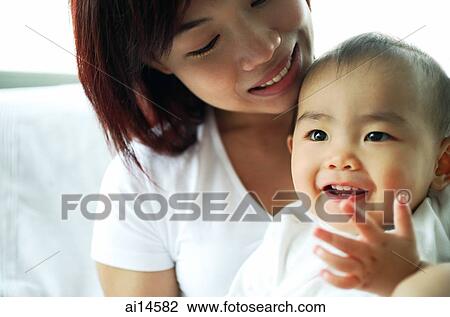 Mother with baby girl, portrait View Large Photo Image Stock Image - Mother with baby girl, portrait. Fotosearch