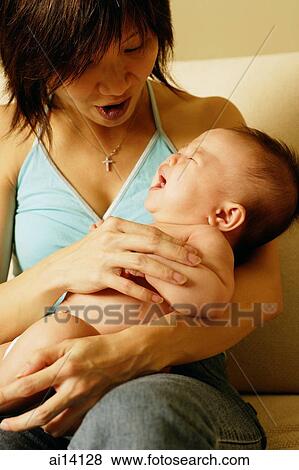 Stock Photo - Mother with baby. Fotosearch