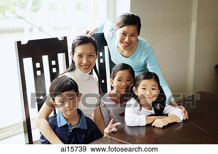 Stock Photo - Mothers with children, looking at camera. Fotosearch