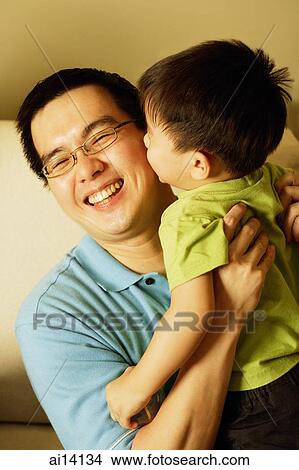 Son kissing father View Large Photo Image Picture - Son kissing father. Fotosearch