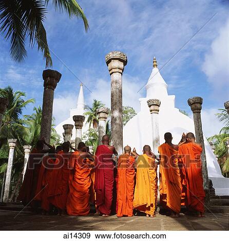 Stock Photo - Sri Lanka, Mihitale, Ambasthala Dagoba, Monks praying in foreground. Fotosearch