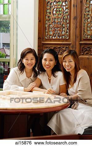 Three friends looking at camera, smiling View Large Photo Image Stock Photograph - Three friends looking at camera, smiling. Fotosearch
