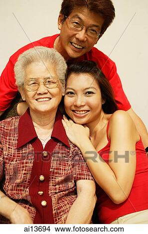 Picture - Three generation family, looking at camera, portrait. Fotosearch