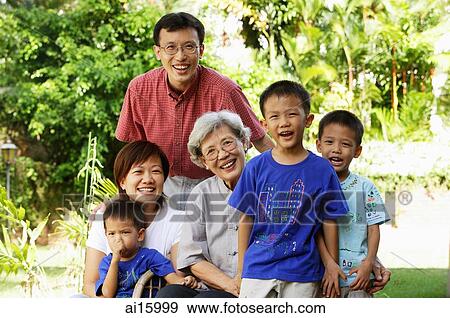Three generation family, smiling at camera View Large Photo Image Stock Photo - Three generation family, smiling at camera. Fotosearch