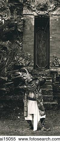 Stock Photography - Topeng dancer performs in temple grounds. Fotosearch