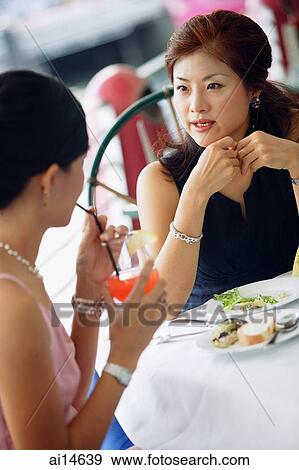 Two women having lunch View Large Photo Image Stock Photo - Two women having lunch. Fotosearch
