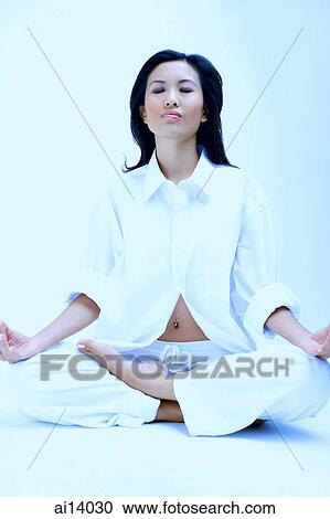 Woman dressed in white, sitting with legs crossed and eyes closed View Large Photo Image Stock Image - Woman dressed in white, sitting with legs crossed and eyes closed. Fotosearch
