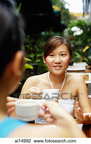 Woman holding cup, over the shoulder view View Large Photo Image Stock Image - Woman holding cup, over the shoulder view. Fotosearch