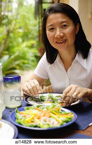 Woman looking at camera, smiling View Large Photo Image Stock Photo - Woman looking at camera, smiling. Fotosearch