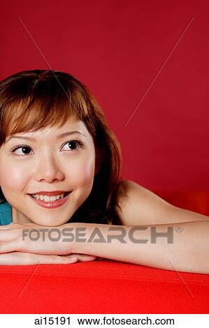 Woman looking away, resting head on hands View Large Photo Image Stock Image - Woman looking away, resting head on hands. Fotosearch