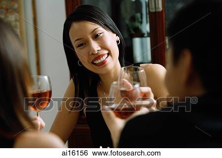 Woman smiling, holding wine glass View Large Photo Image Stock Photograph - Woman smiling, holding wine glass. Fotosearch