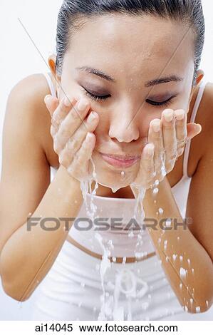 Woman splashing face with water View Large Photo Image Stock Photography - Woman splashing face with water. Fotosearch