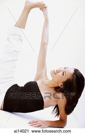 Woman stretching, touching foot View Large Photo Image Stock Image - Woman stretching, touching foot. Fotosearch
