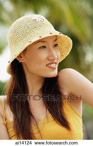 Woman wearing hat, looking away View Large Photo Image Picture - Woman wearing hat, looking away. Fotosearch