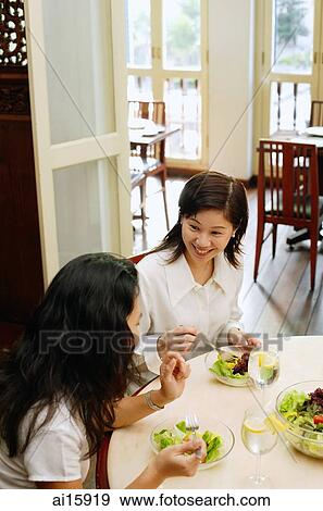 Women at a cafe, having lunch, high angle view View Large Photo Image Stock Photo - Women at a cafe, having lunch, high angle view. Fotosearch