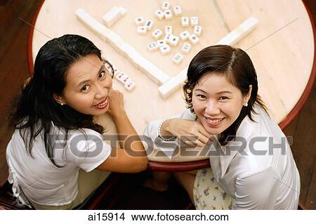 Women at mahjong table, looking at camera, high angle view View Large Photo Image Picture - Women at mahjong table, looking at camera, high angle view. Fotosearch