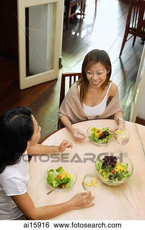 Women having a meal of salad, high angle view View Large Photo Image Stock Photograph - Women having a meal of salad, high angle view. Fotosearch