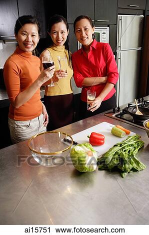 Women in kitchen, smiling at camera View Large Photo Image Stock Image - Women in kitchen, smiling at camera. Fotosearch
