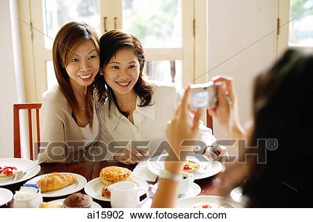 Women posing for photograph View Large Photo Image Stock Image - Women posing for photograph. Fotosearch