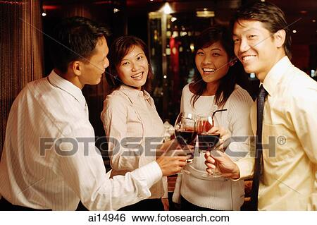 Young executives toasting with wine glasses View Large Photo Image Stock Photograph - Young executives toasting with wine glasses. Fotosearch