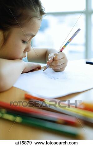 Stock Photo - Young girl drawing, resting chin on arm. Fotosearch