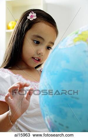 Young girl looking at globe View Large Photo Image Stock Image - Young girl looking at globe. Fotosearch