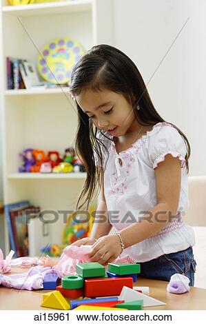 Young girl playing with toys View Large Photo Image Stock Image - Young girl playing with toys. Fotosearch