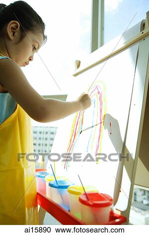 Young girl with apron, painting a rainbow View Large Photo Image Stock Image - Young girl with apron, painting a rainbow. Fotosearch