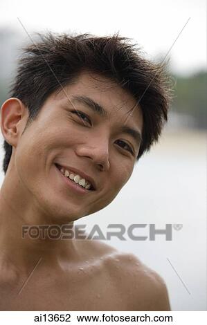 Young man, looking at camera, head shot View Large Photo Image Stock Image - Young man, looking at camera, head shot. Fotosearch