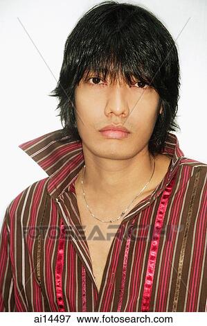 Young man looking at camera, portrait View Large Photo Image Stock Photo - Young man looking at camera, portrait. Fotosearch