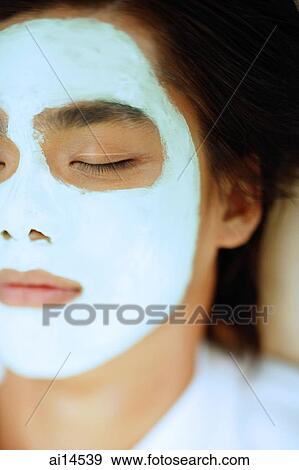 Young man with facial mask, eyes closed View Large Photo Image Stock Photo - Young man with facial mask, eyes closed. Fotosearch