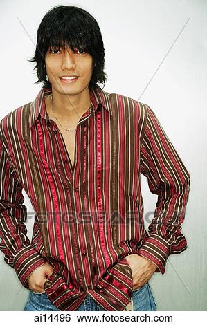 Young man with hands in pocket, portrait View Large Photo Image Stock Photograph - Young man with hands in pocket, portrait. Fotosearch