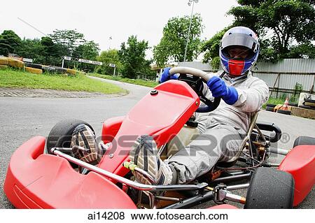 Stock Photo - Young woman in go-cart, portrait. Fotosearch