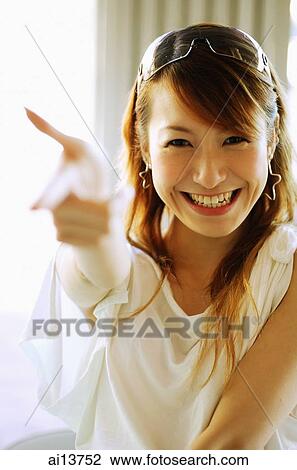 Young woman, pointing finger View Large Photo Image Stock Image - Young woman, pointing finger. Fotosearch