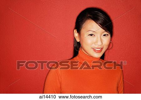 Young woman smiling at camera, portrait View Large Photo Image Stock Image - Young woman smiling at camera, portrait. Fotosearch