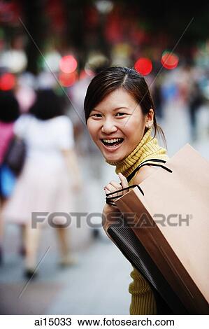 Young woman, smiling, looking at camera, portrait View Large Photo Image Stock Image - Young woman, smiling, looking at camera, portrait. Fotosearch