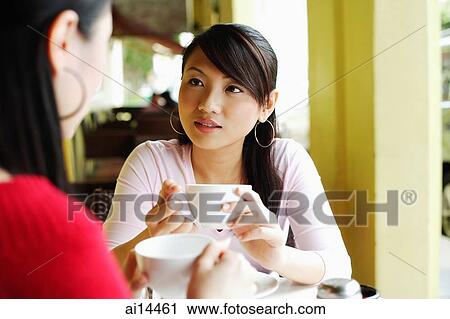 Young women at cafe, having coffee View Large Photo Image Stock Image - Young women at cafe, having coffee. Fotosearch
