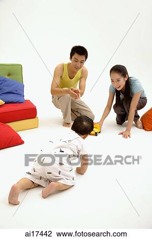 Baby by crawling towards his parents View Large Photo Image Stock Image - Baby by crawling towards his parents . Fotosearch