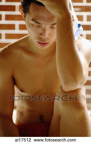 Bare chested man, with hand on head View Large Photo Image Stock Image - Bare chested man, with hand on head . Fotosearch