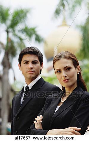 Business people standing, looking at camera View Large Photo Image Stock Photo - Business people standing, looking at camera . Fotosearch