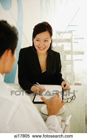 Business people talking over coffee View Large Photo Image Stock Photography - Business people talking over coffee . Fotosearch