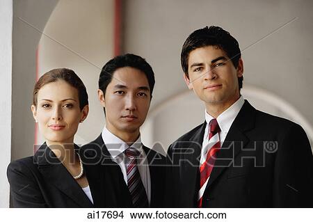 Businessman and businesswoman looking at camera View Large Photo Image Picture - Businessman and businesswoman looking at camera . Fotosearch