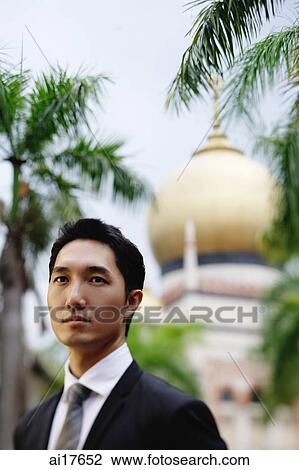 Businessman, head shot, mosque in the background View Large Photo Image Stock Image - Businessman, head shot, mosque in the background . Fotosearch