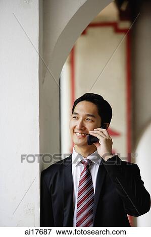 Businessman using mobile phone View Large Photo Image Stock Photo - Businessman using mobile phone . Fotosearch
